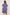 Woman wearing a blue patterned romper against a white background