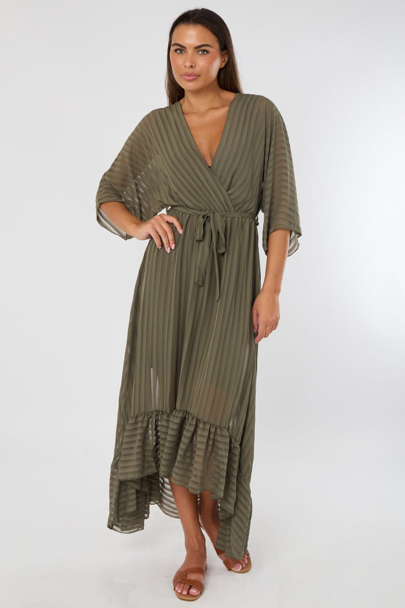 Woman wearing a green dress with a white background
