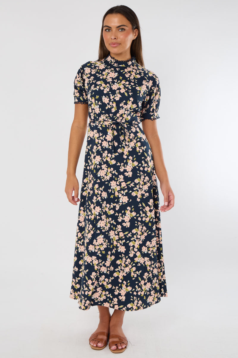 Woman wearing a floral dress on a white background