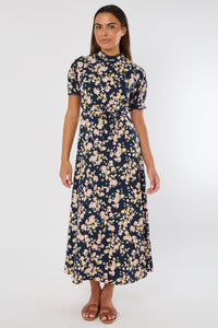 Woman wearing a floral dress on a white background