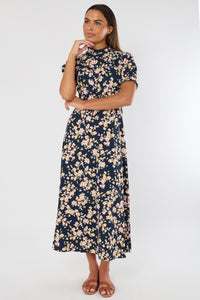 Woman wearing a floral dress on a white background