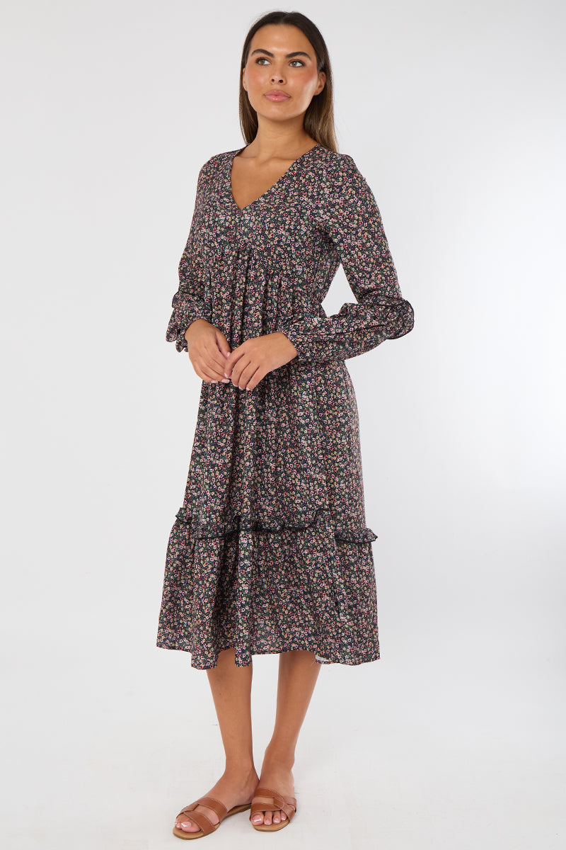 Woman wearing a floral dress on a white background