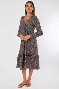 Woman wearing a floral dress on a white background