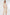 Woman wearing a beige ribbed dress on a white background