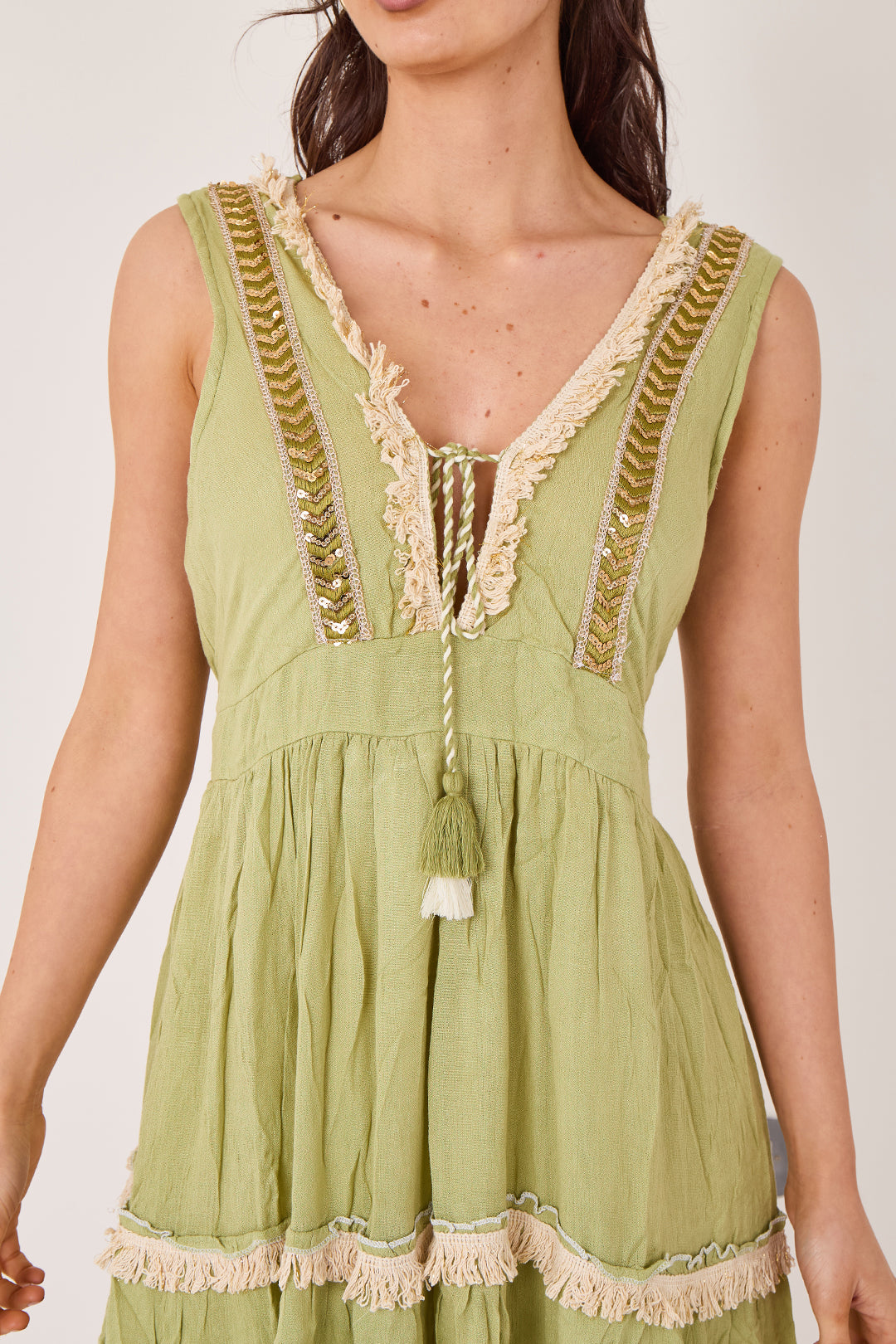 Boho tiered tassel detail dress with embroidered neckline and frill hem front view