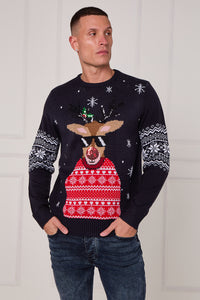 Man wearing a festive sweater with a reindeer design against a white background