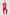 Woman wearing a hot pink satin pyjama set with short sleeves and long trousers, featuring dark-coloured piping details, standing against a neutral background