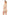 Woman wearing a beige romper on a white background